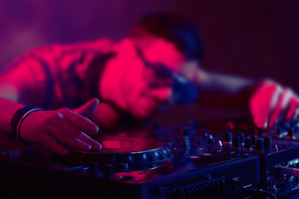 DJ playing music at mixer  - Photo, Image