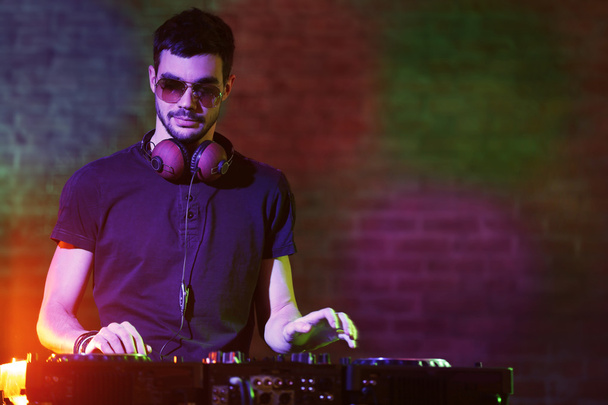 DJ playing music at mixer  - Foto, immagini