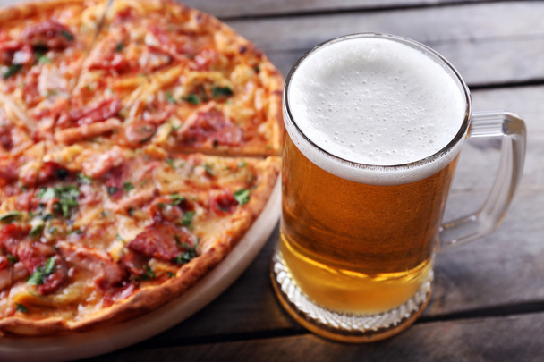 Tasty pizza and glass of beer  - Photo, image