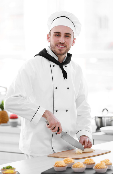 Chef working at kitchen - Fotó, kép