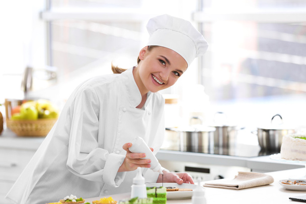 Female chef working at kitchen - Zdjęcie, obraz