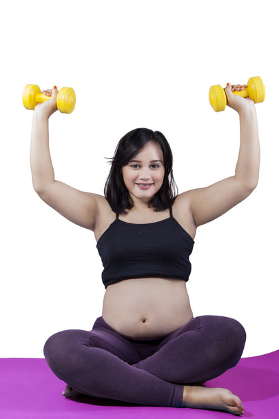 Expectant mother workout with dumbbells - Foto, Imagen