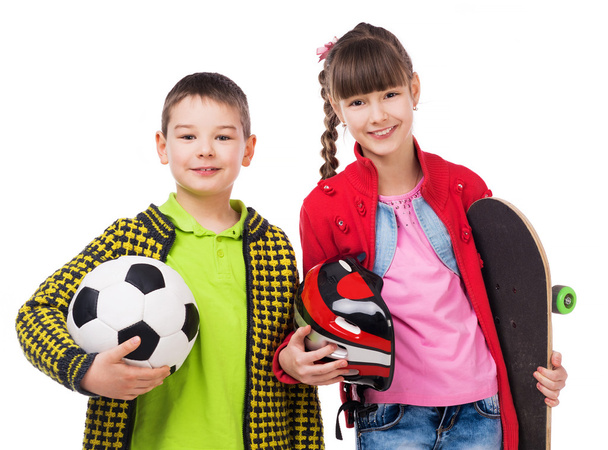 playful children holding sport equipment in hands - Foto, afbeelding