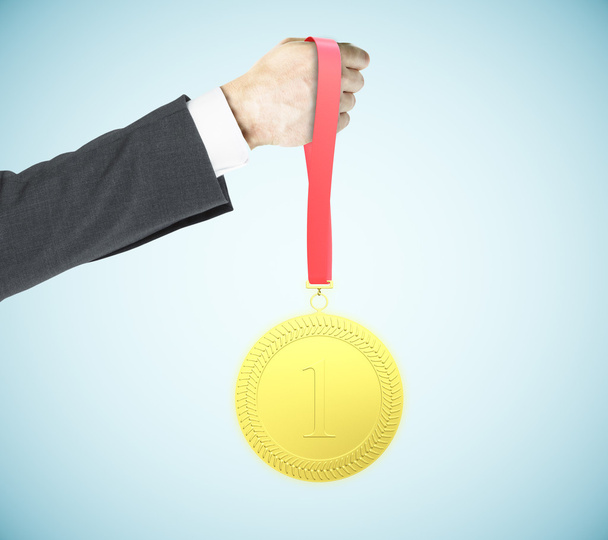 Businessman holding medal - Photo, Image