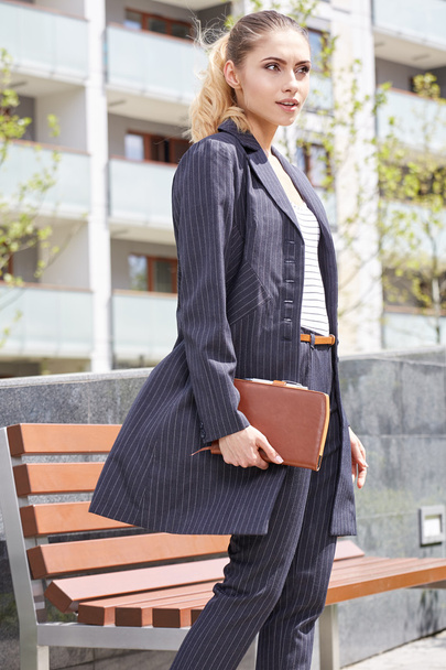 Businesswoman holding notebook - Fotó, kép