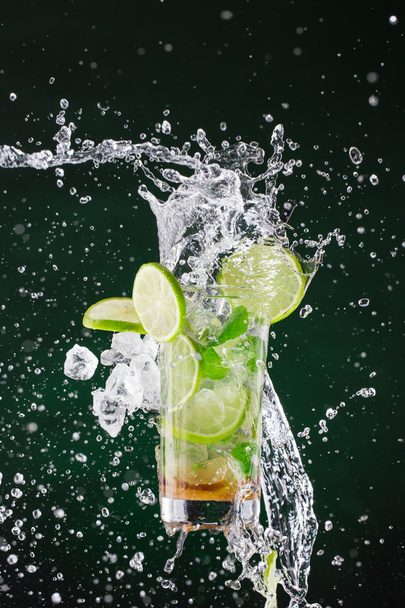 fresh mojito drink with liquid splash. - Photo, image