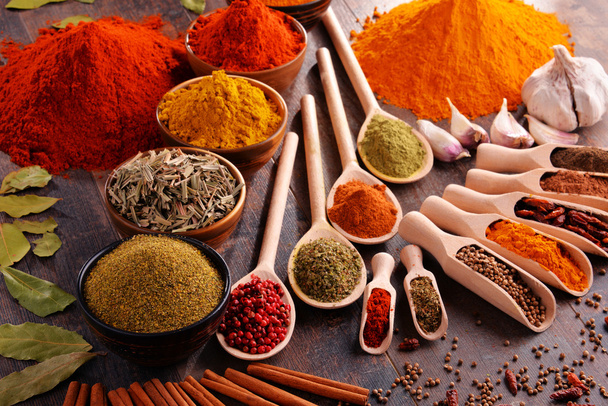 Variety of spices on kitchen table - Photo, Image