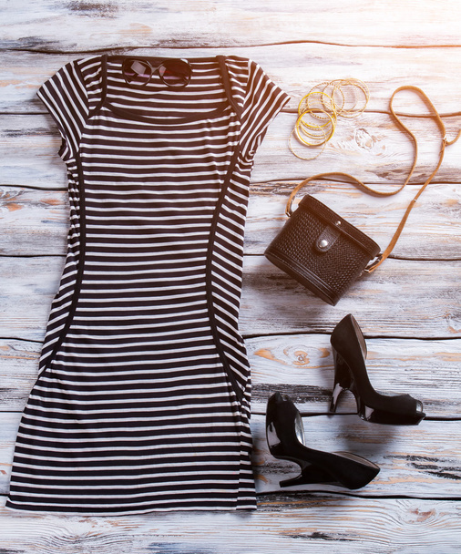 Striped dress and black purse. - Photo, Image