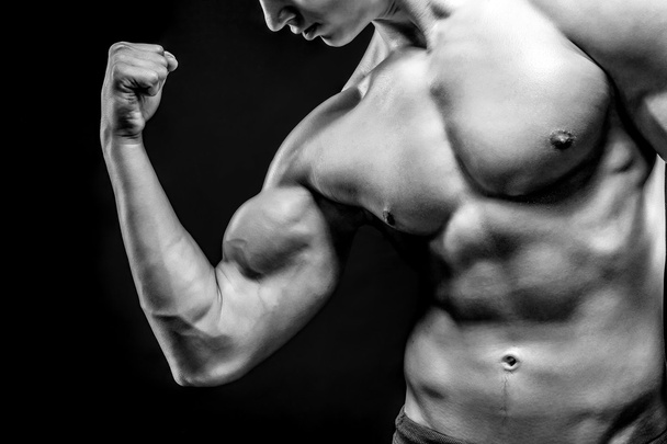 Image of very muscular man posing with naked torso - Foto, Imagem