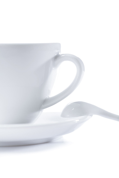 White cup on saucer with spoon isolated - Foto, Bild