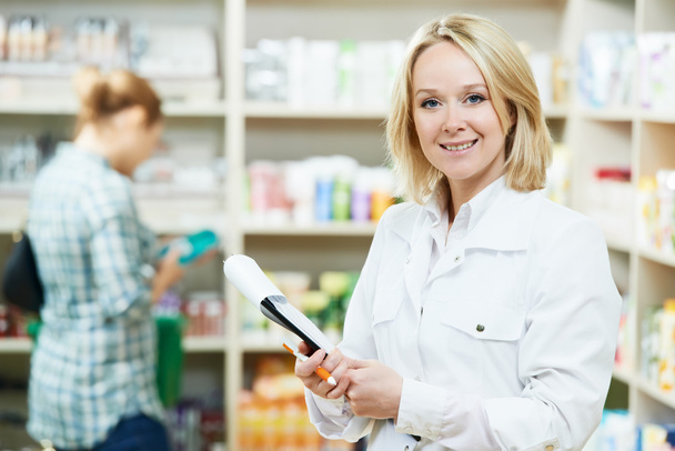 Pharmacy chemist woman in drugstore - Foto, imagen