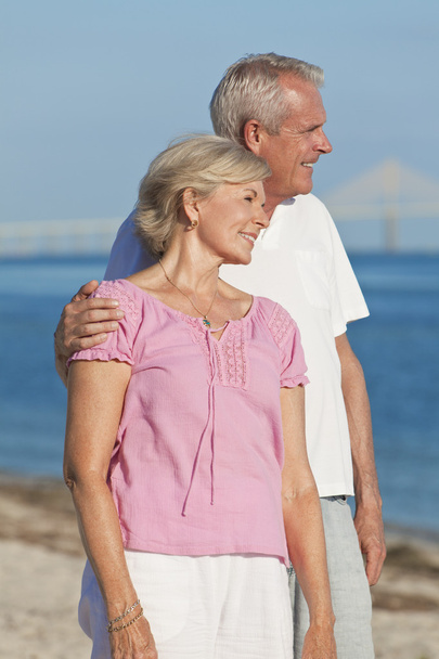 Happy Romantic Senior Couple Embracing on Beach - Photo, Image