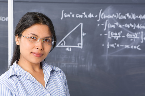 Student pose in front of blackboard - Foto, Bild