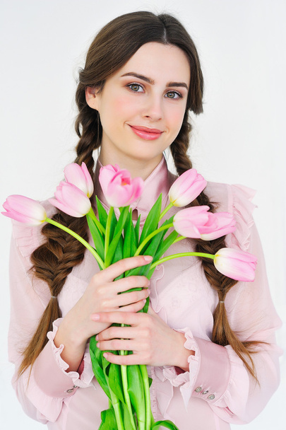 Smiling woman with bunch of tulips - Valokuva, kuva