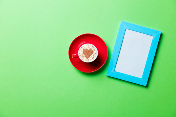 cup and photo frame - Foto, imagen