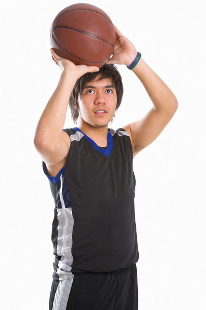 Basketball player is about to throw the ball - Foto, Bild