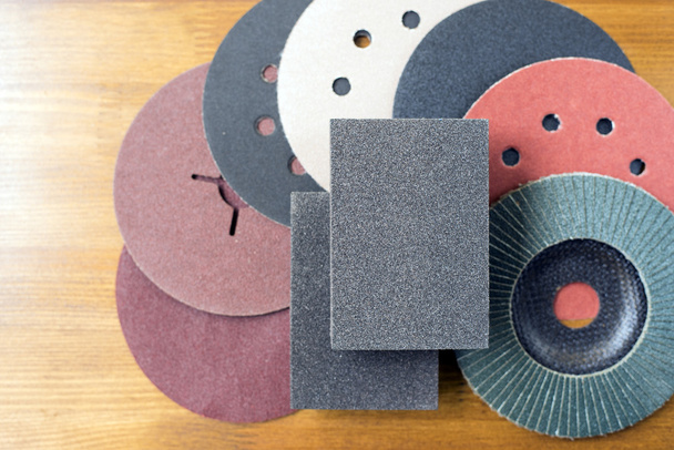 Abrasive materials - sheets of sandpaper and disks close-up - Photo, Image