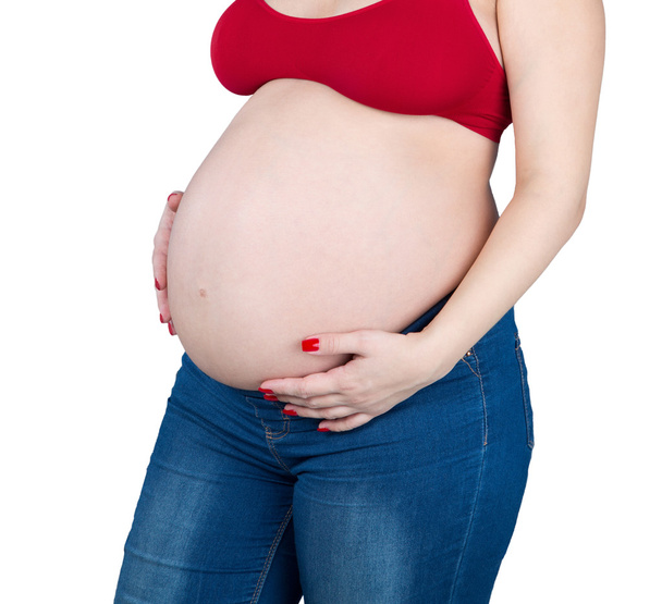 Obrázek z těhotné ženy dotýká břicho ruce.  - Fotografie, Obrázek