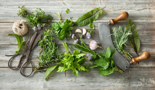 fresh herbs and spices on wooden table - Fotó, kép