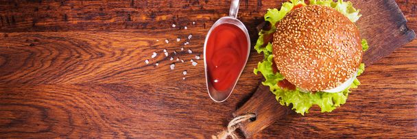 Homemade burger on a wooden background. Rustic style - Photo, image