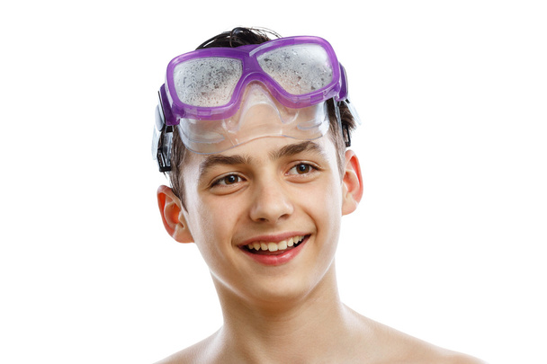 Boy diver in swimming mask with a happy face close-up portrait, isolated on white - Fotó, kép