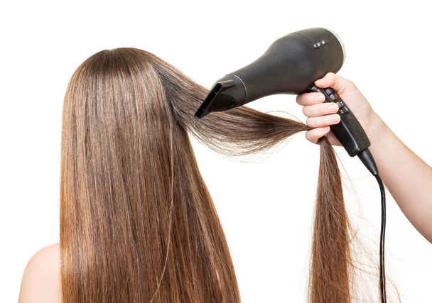 Long  hair, and hair dryer in  hand isolated on white. - Zdjęcie, obraz