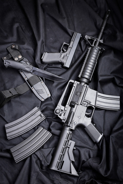 set of guns on black cloth - Photo, image
