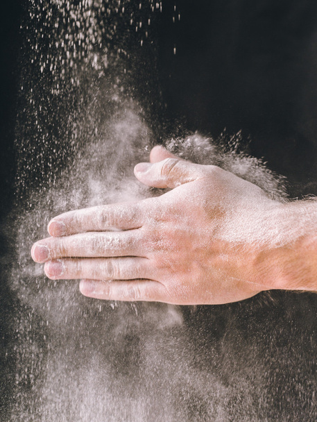 adult man hands work with flour, dark photo - Foto, Imagem