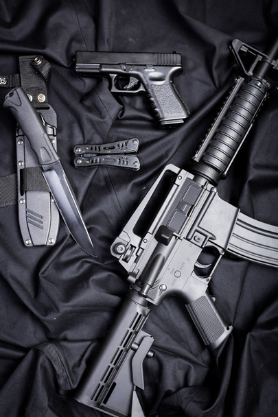 set of guns on black cloth - Fotó, kép