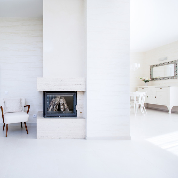 The fireplace in the open space inside the apartment - Fotoğraf, Görsel