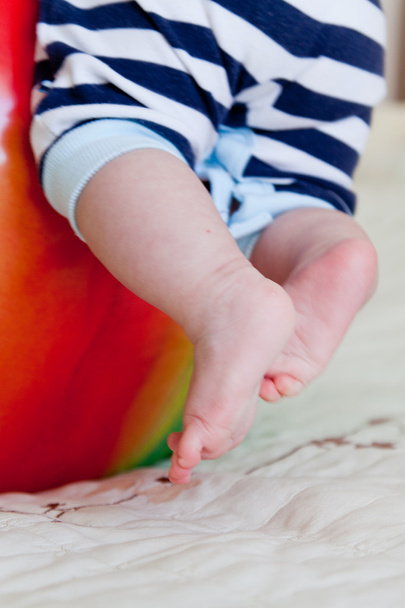 Baby feet on the ball - Фото, зображення