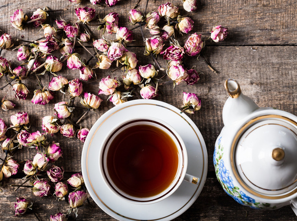 Vintage teapot and cup with flowers - Fotó, kép
