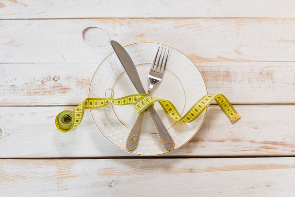 measuring tape and cutlery - Фото, изображение