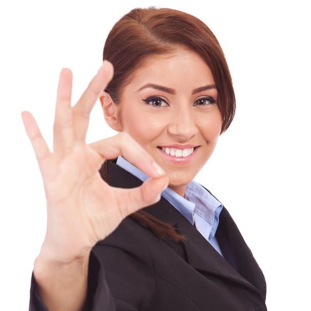 Business woman indicating ok sign - Foto, afbeelding