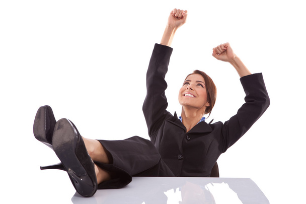 Relaxed and winning business woman sitting - Foto, imagen