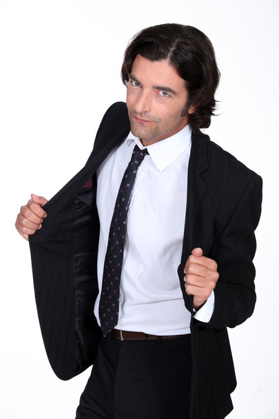 άνθρωπος άνοιγμα σακάκι του κοστούμι - Φωτογραφία, εικόνα