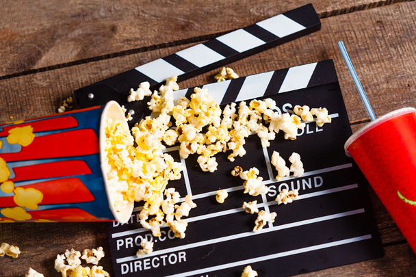 popcorn, drink and movie clapboard  - Фото, изображение