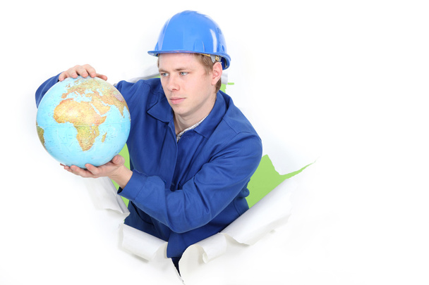 Tradesman holding a globe - Fotografie, Obrázek