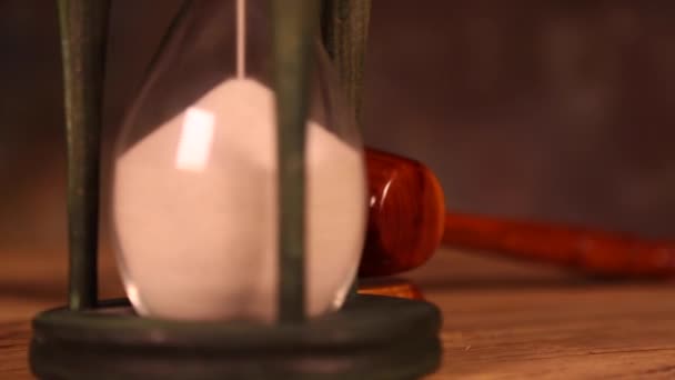 Hourglass with wooden gavel   - Footage, Video