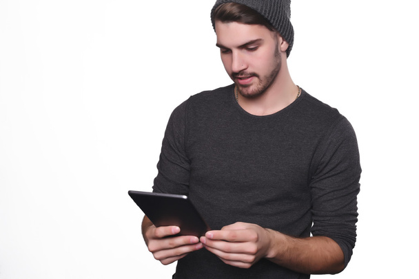 Portrait of young man using tablet. - Фото, зображення