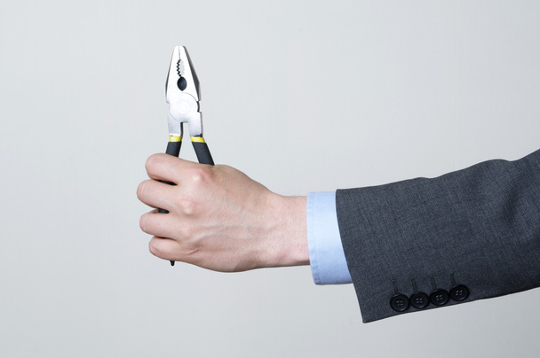 Holding a tool - Photo, Image