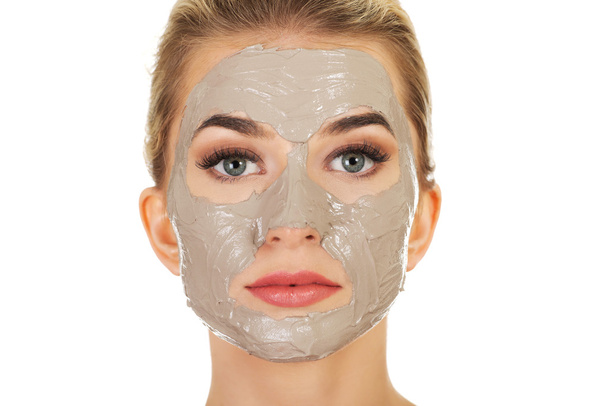 Young  woman with facial mask - Фото, изображение