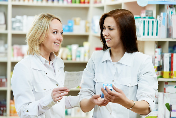 Pharmacy chemist women in drugstore - Foto, immagini