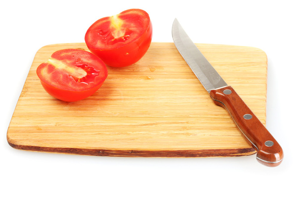 Ripe red tomatoes and knife on cutting board isolated on white - Foto, afbeelding