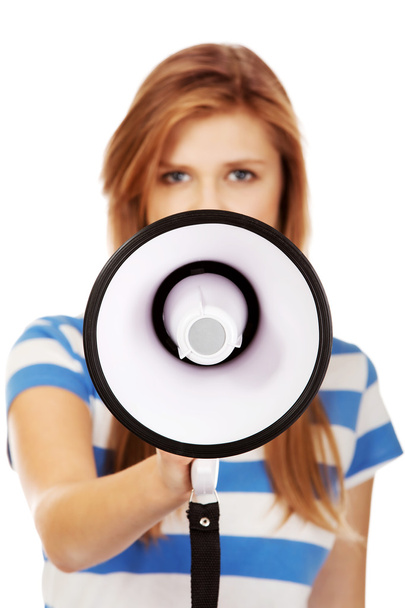 Screaming young teenage woman with megaphone - Photo, image