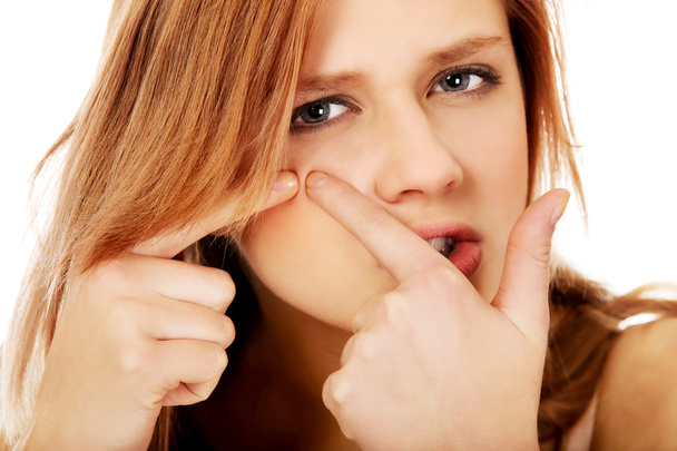 Teenage angry woman poping pimple - Φωτογραφία, εικόνα