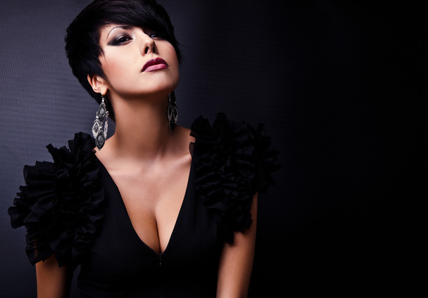 Beautiful woman on black classical dress pose in studio. - Fotografie, Obrázek