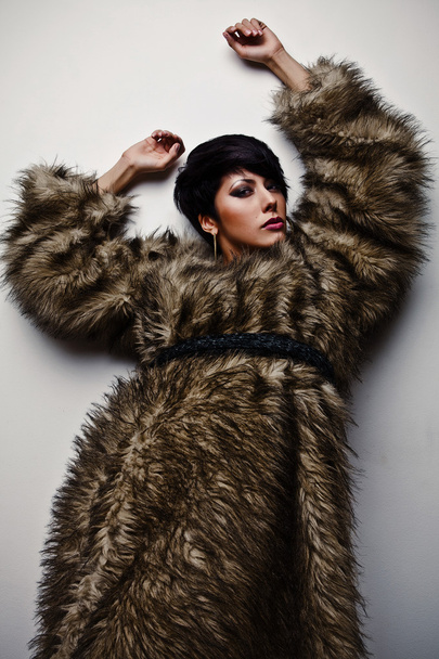 Elegant fashionable woman in fur. Fashion photo. - Фото, изображение