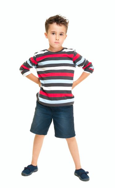 Single naughty little boy standing - Foto, imagen