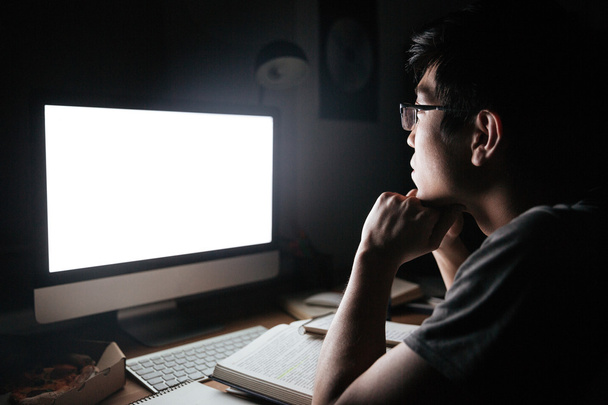 Man in glasses studying using blank screen computer - Photo, Image